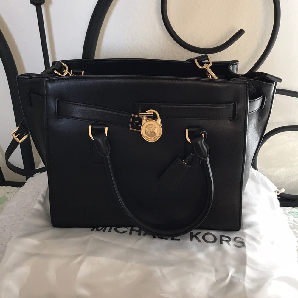 Black Michael Kors satchel with gold hardware